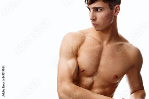 male athlete with biceps and cubes on the stomach naked torso model