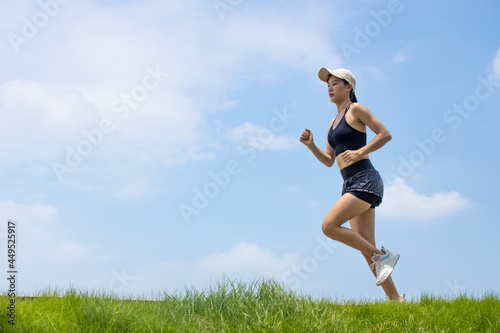 Young asian girls running and fitness in the morning