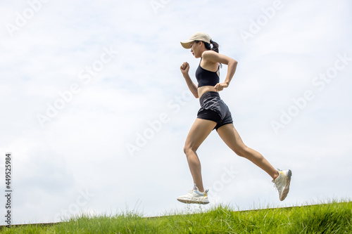 Young asian girls running and fitness in the morning