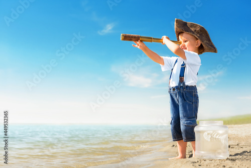 Принти на полотні Kid play on the beach on a hot sunny day