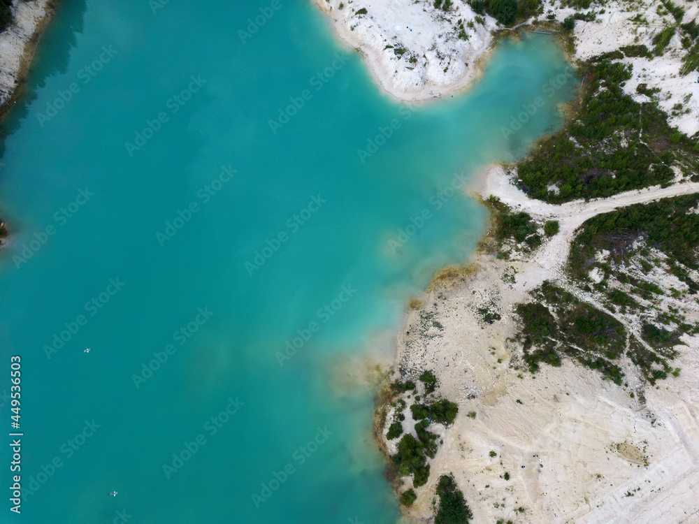 kaolin quarry with turquoise water and white clay.aerial view