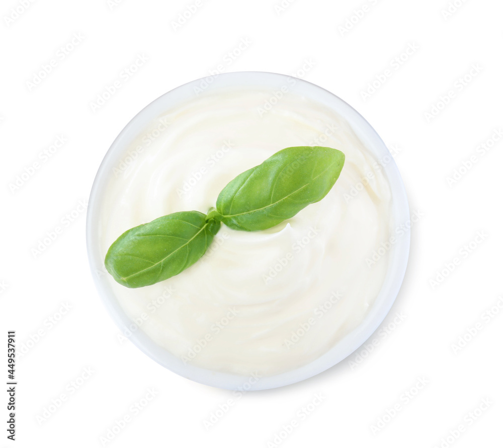 Delicious sour cream with basil in bowl on white background, top view Delicious sour cream with basil in bowl on white background, top view