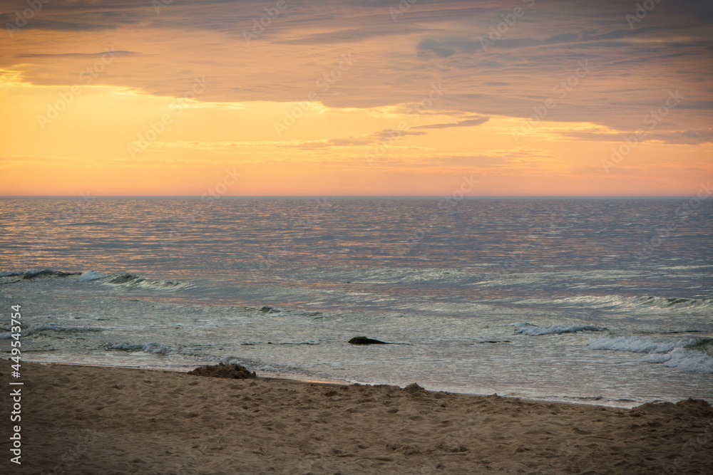 View on landscape of sunset, sea with wave and beach. Travel concept. Summer time