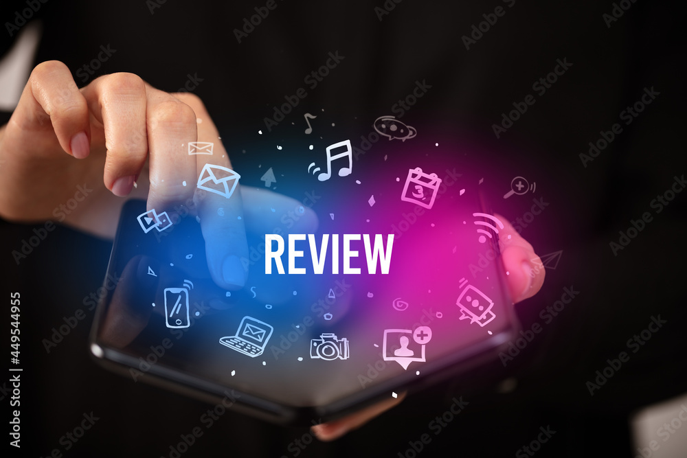 Businessman holding a foldable smartphone, social media concept Businessman holding a foldable smartphone, social media concept