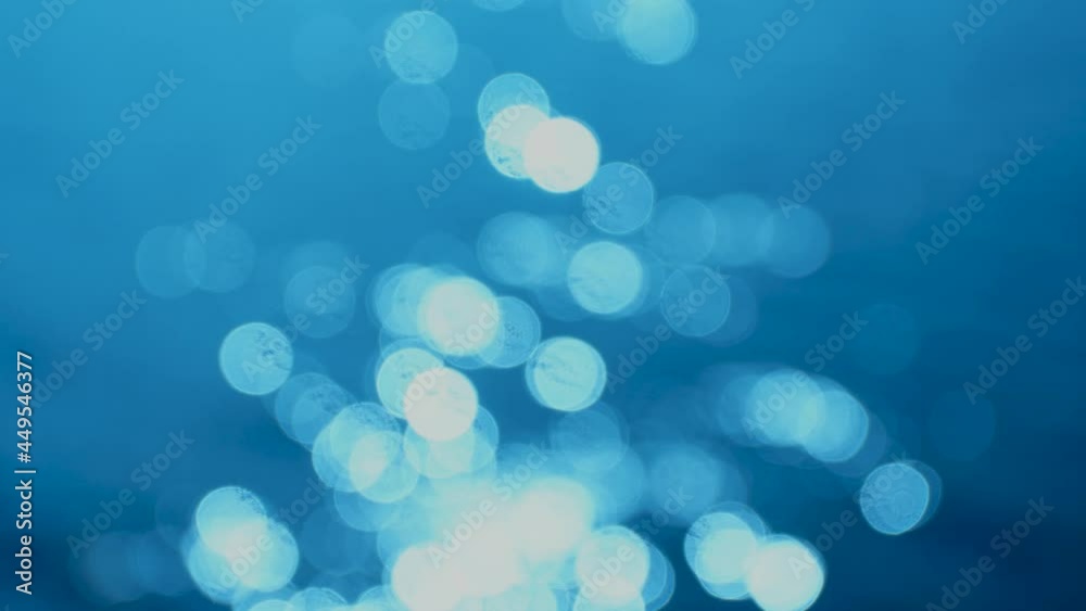 Beautiful 4k abstract gradient video background. Blue bokeh on rippling surface of sunny water Beautiful 4k abstract gradient video background. Blue bokeh on rippling surface of sunny water