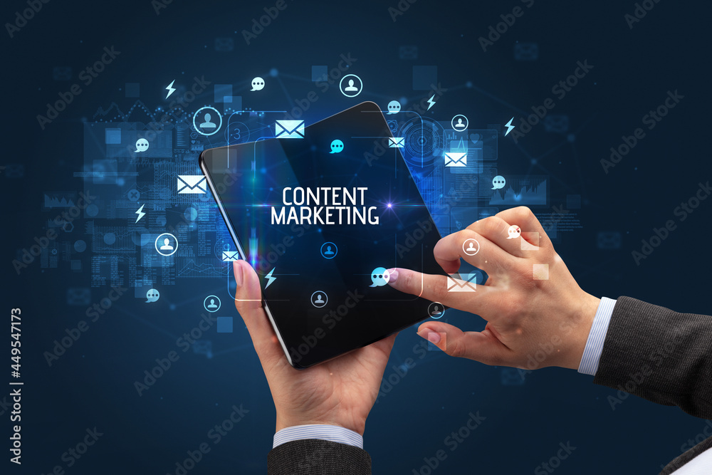 Businessman holding a foldable smartphone, social media concept Businessman holding a foldable smartphone, social media concept