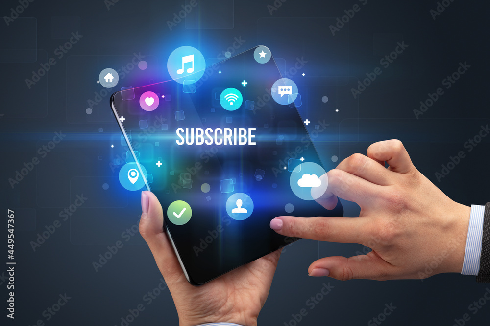 Businessman holding a foldable smartphone Businessman holding a foldable smartphone