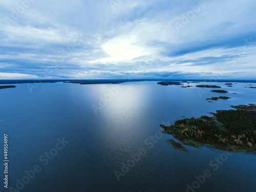 The Clouds over the lake panorama aerial. Evening landscape aerial. Aerial panorama. Clouds on the river in the evening.