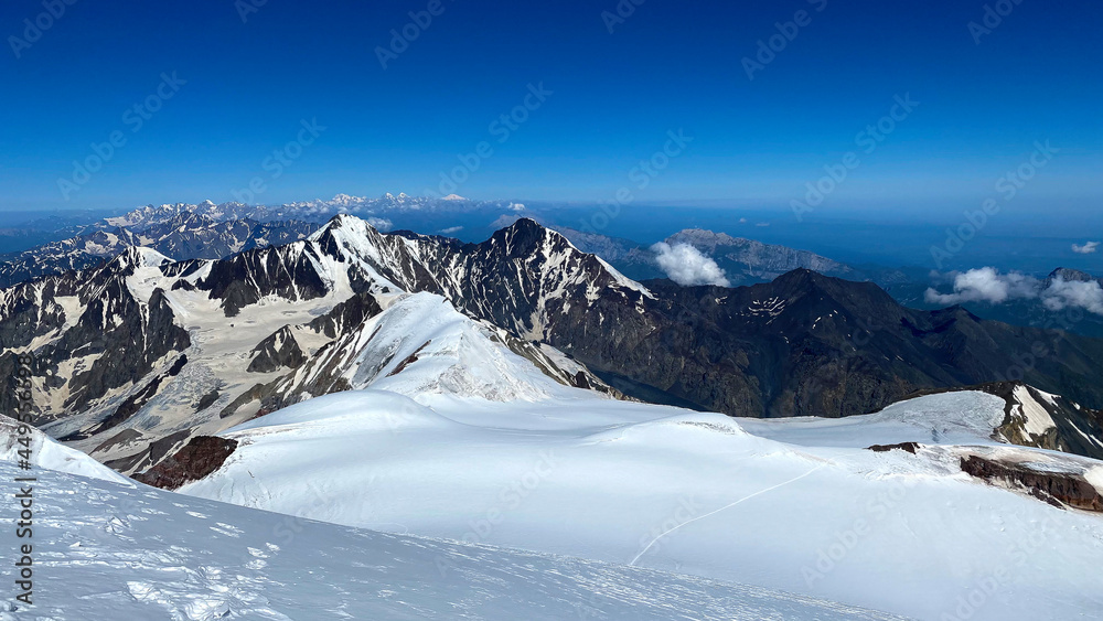 View from the top of Mount Kazbek. Hike across the Caucasus. Mountains, rocks and hills.