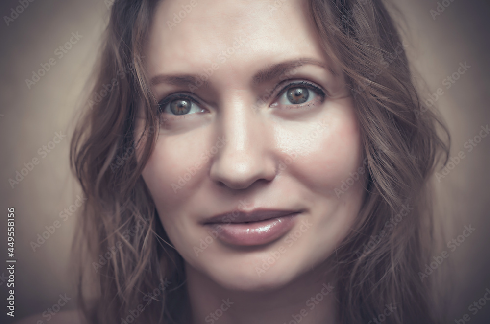 Closeup portrait of beautiful woman with brown hair looking up Closeup portrait of beautiful woman with brown hair looking up