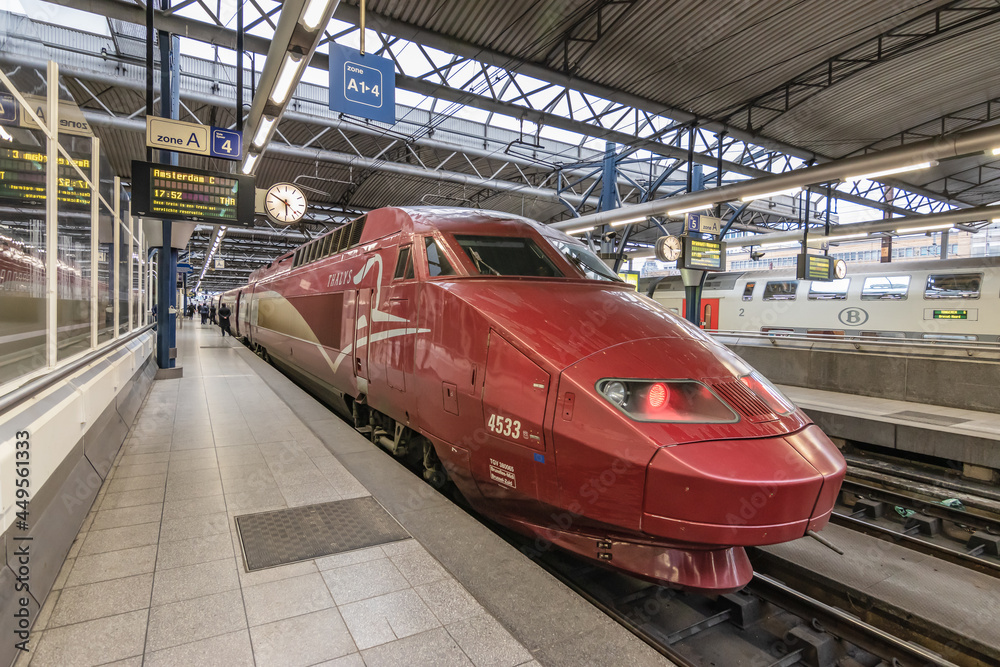 BRUSSELS, BELGIUM - March 12, 2019: International high speed train Thalys  arriving in railway station Brussels-South (Bruxelles-Midi or Brussel-Zuid)  heading to Amsterdam. Photos | Adobe Stock