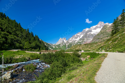 Summer trekking day in the mountains of Val Veny, Courmayeur