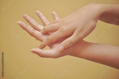 Close up of a hand using hand sanitizer.