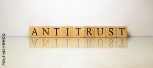 The name antitrust was created from wooden letter cubes. finance and economy.