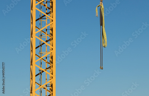 Crane construction tower with yellow steel bars suitable for industrial and building illustrational purposes