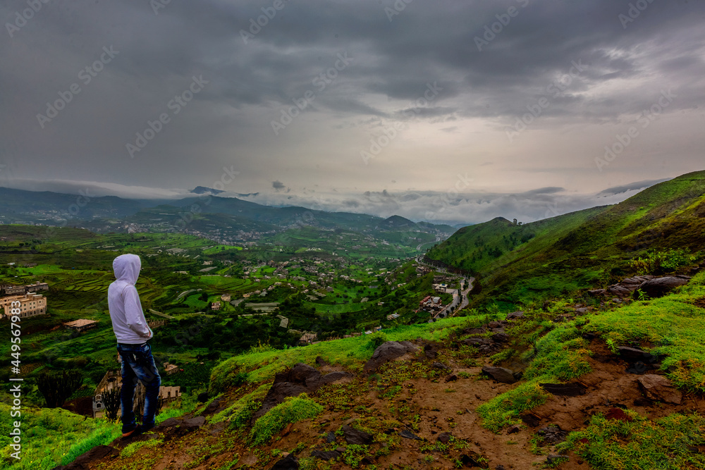 beautiful landscape view to Ibb City, Yemen. traveler standing on the top of mountain with misty foggy landscape watching the beauty from countryside 
