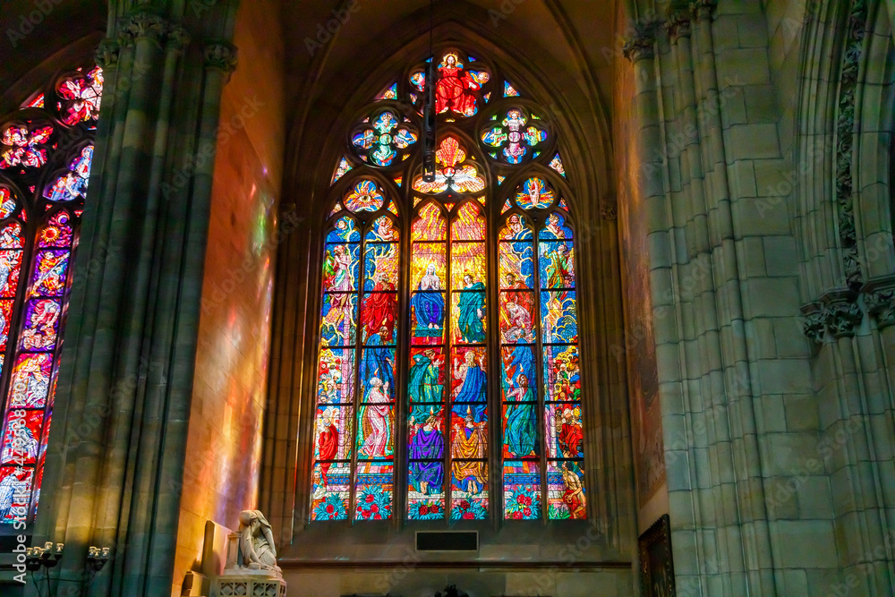 Multicolored stained glass windows in the Catholic Cathedral of St. Vitus in Prague