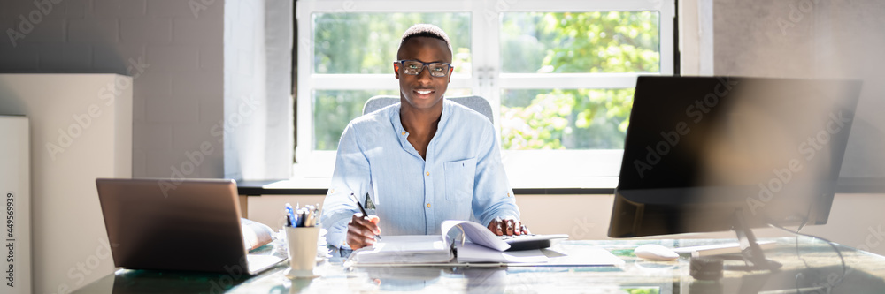 African American Accountant Manager Doing Tax African American Accountant Manager Doing Tax