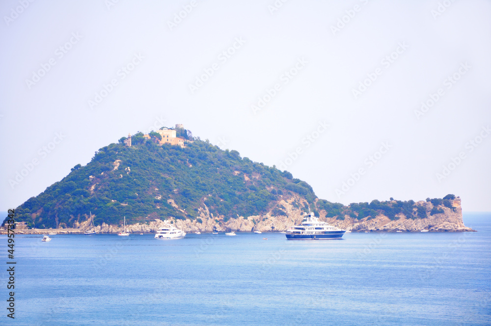 The island of Gallinara or Isola d'Albenga, in the ligurian sea. Small and large yachts and boats near the island.