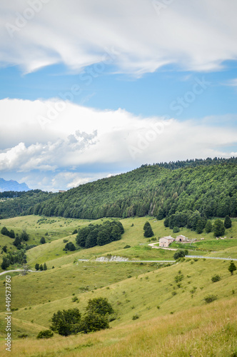 Fantastic landscape with a road that crosses the mountains seen from Passo Fittanze Di Sega, in Lessinia, near Verona in Italy