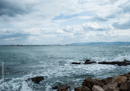 Soft waves of blue sea on sandy coast. Mediterranean sea.