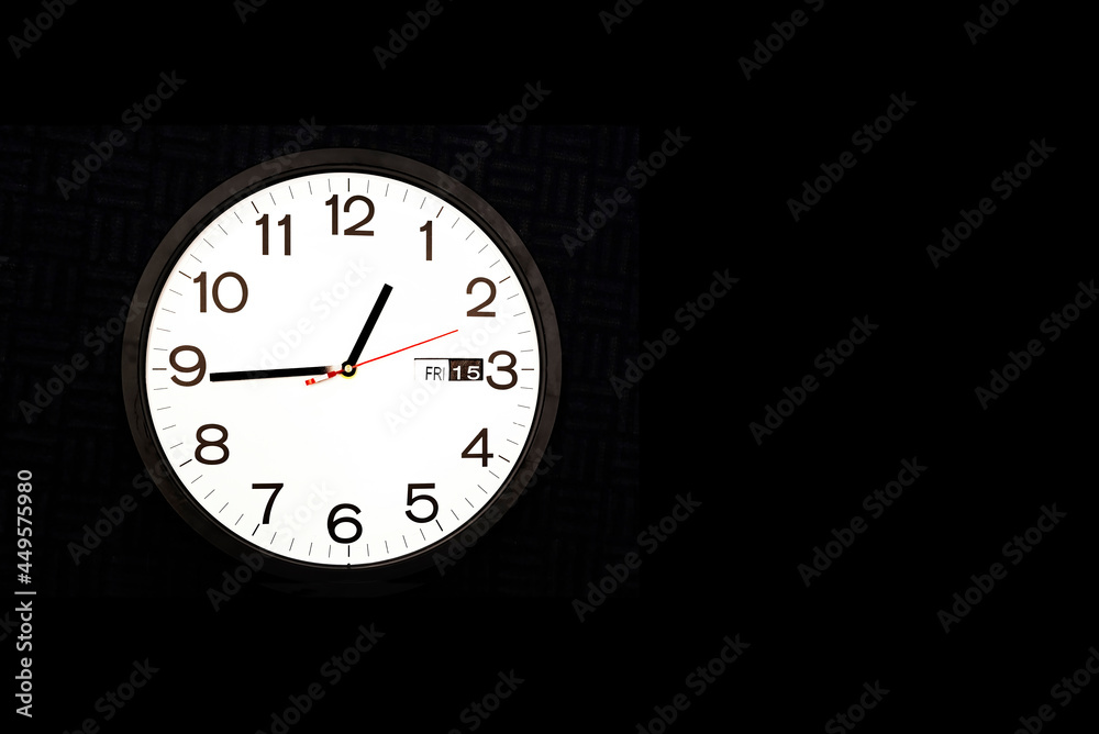 Clock on black background with copy space right side Clock on black background with copy space right side