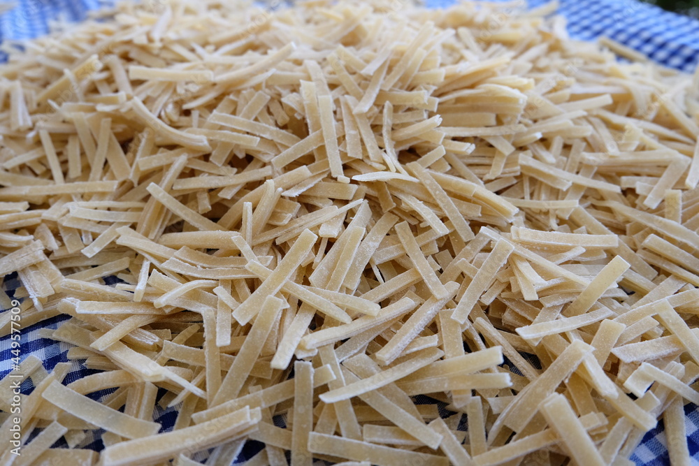 Preparing process of homemade Turkish noodle, selective focus. Noodles are the pasta that Turkish women make. It is called Preparing process of homemade Turkish noodle, selective focus. Noodles are the pasta that Turkish women make. It is called