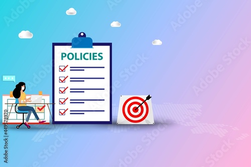 Concept of company policy, women staff wear a face mask and working on her laptop and read the list of policies that shown on a big screen of clipboard to understand in pastel color background.