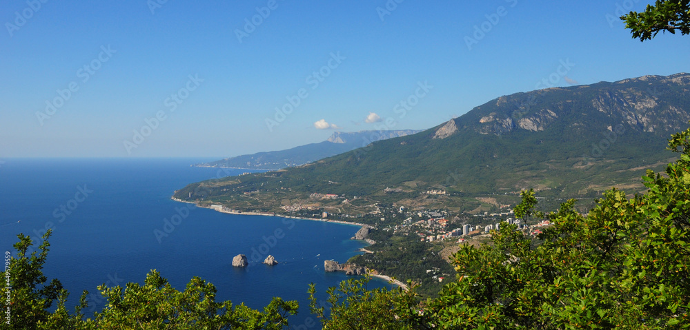A view of Black Sea with Adalary rocks, a resort town Gurzuf, the International Children Center Artek along the picturesque coast of Crimean peninsula.