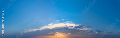 Wide angle panorama of Blue Morning Sky with glare of the Sun. Wide morning panorama of rising Sun at Dawn.