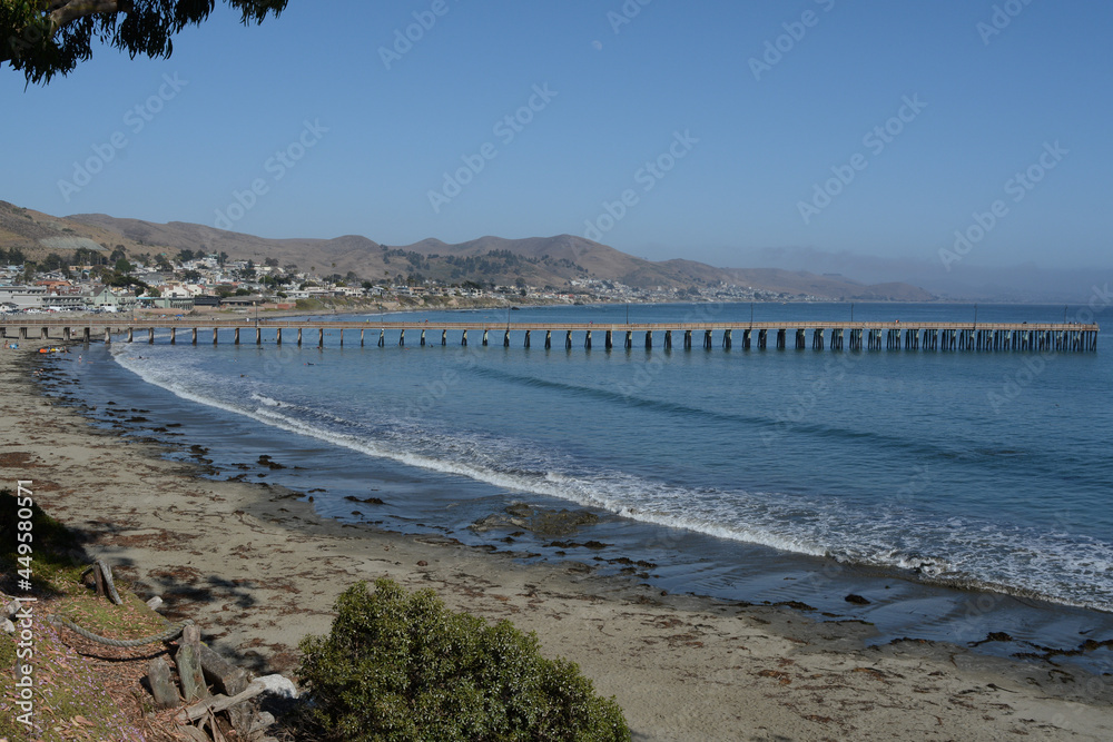 Cayucos State Beach with the Cayucos Pier on Estero Bay. In San Luis Obispo County, California