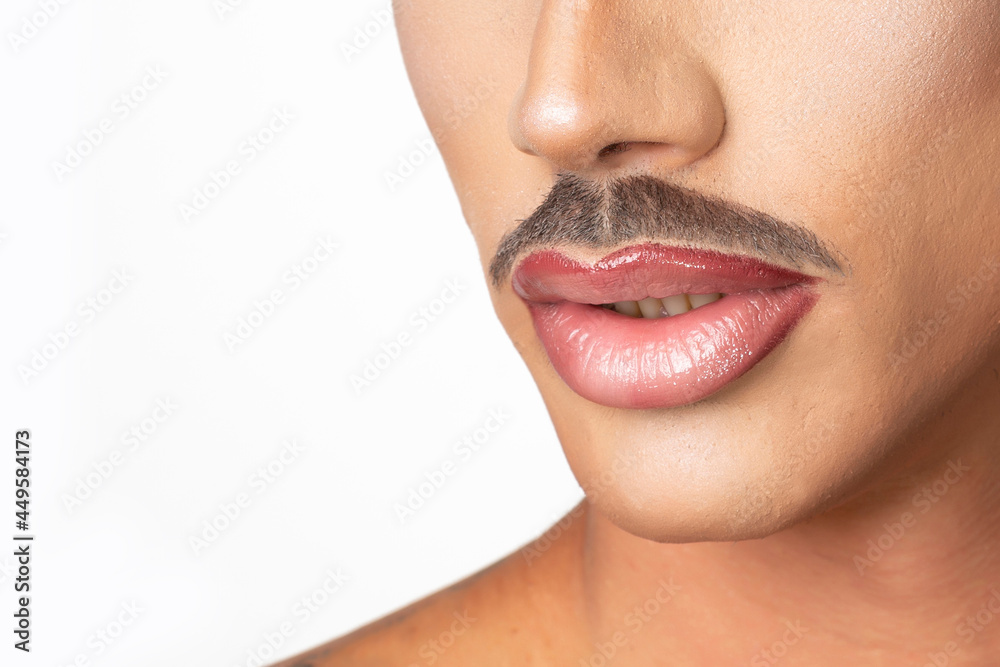 Obraz premium closeup of man with makeup mustache and red lipstick on white background