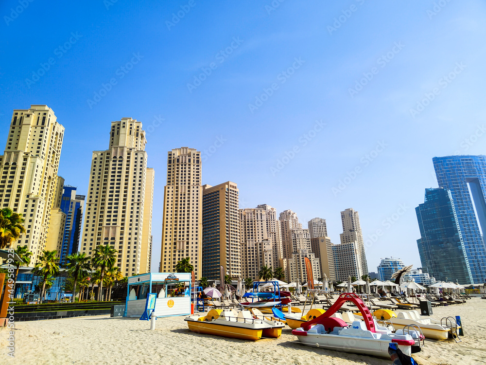 Skyscrapers living zone with catamarans near beach Skyscrapers living zone with catamarans near beach