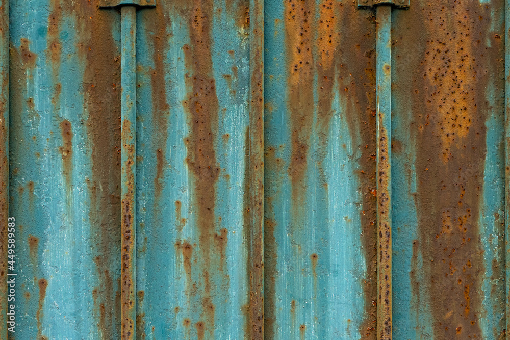 Texture rusty metal door  with brown and blue bars