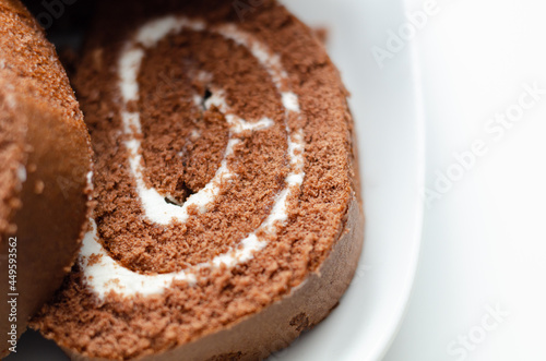 Chocolate sponge roll with a vanilla flavour filling, chocolate swiss roll