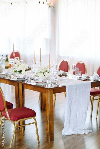 Neatly decorated table for the event. Beautiful serving. Wedding, birthday, party, event concept.
