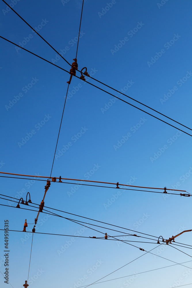 Electric traction lines against the blue sky Electric traction lines against the blue sky