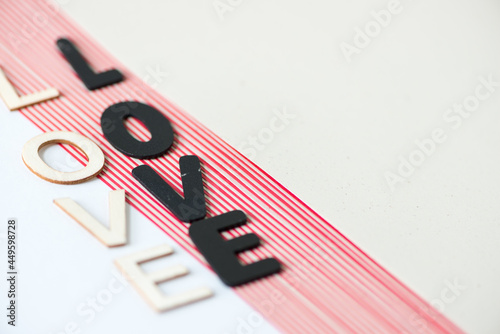 фотографія the word love (double) on plain and striped paper background