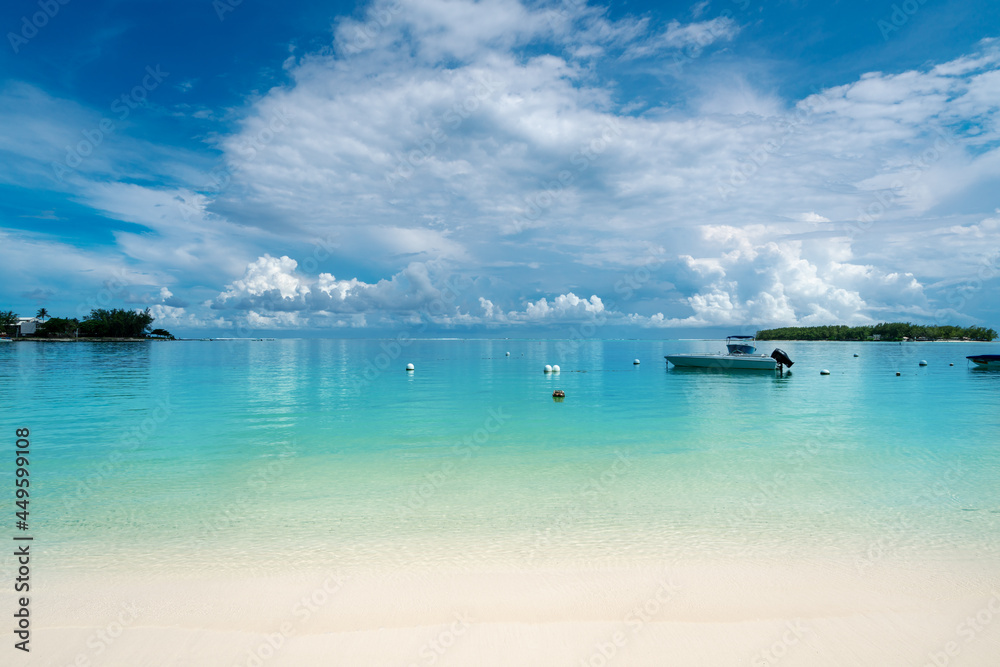 Fototapeta premium Idyllic tropical tourist destination on the Blue Bay beach with blue sea water in the summertime - Mauritius