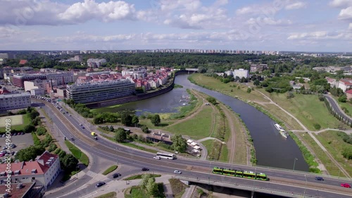 Poznan, Polish city during the day. The sun, the old town, the streets of Poznań, the Warta River and bridges over the river.