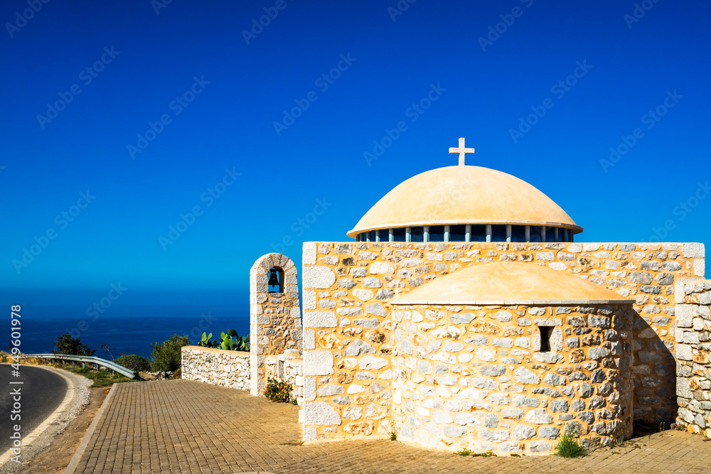 Picturesque chapel at the street to village of Limeni with clear waters, Mani, Peloponnese, Greece