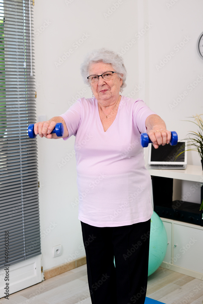 portrait of an active and dynamic senior woman doing sport fitness at home portrait of an active and dynamic senior woman doing sport fitness at home