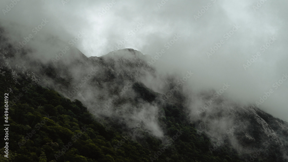 Fog in a big mountain in a cloudy day