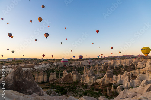 The silhouette of ballons rising at the sunrise in Cappadocia, Turkey