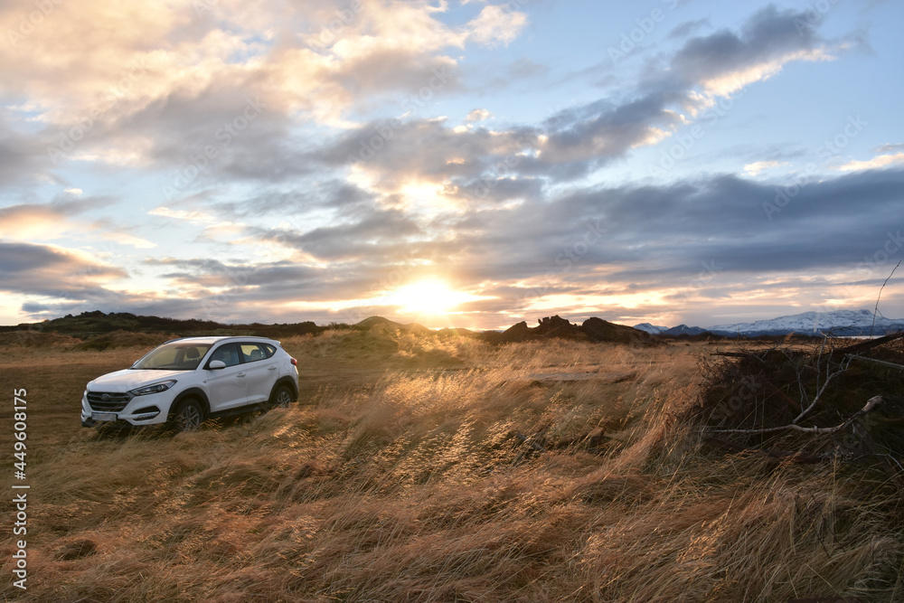 Abandoned landscape during winter in Iceland, Europe. Car with a sunset background. Abandoned landscape during winter in Iceland, Europe. Car with a sunset background.