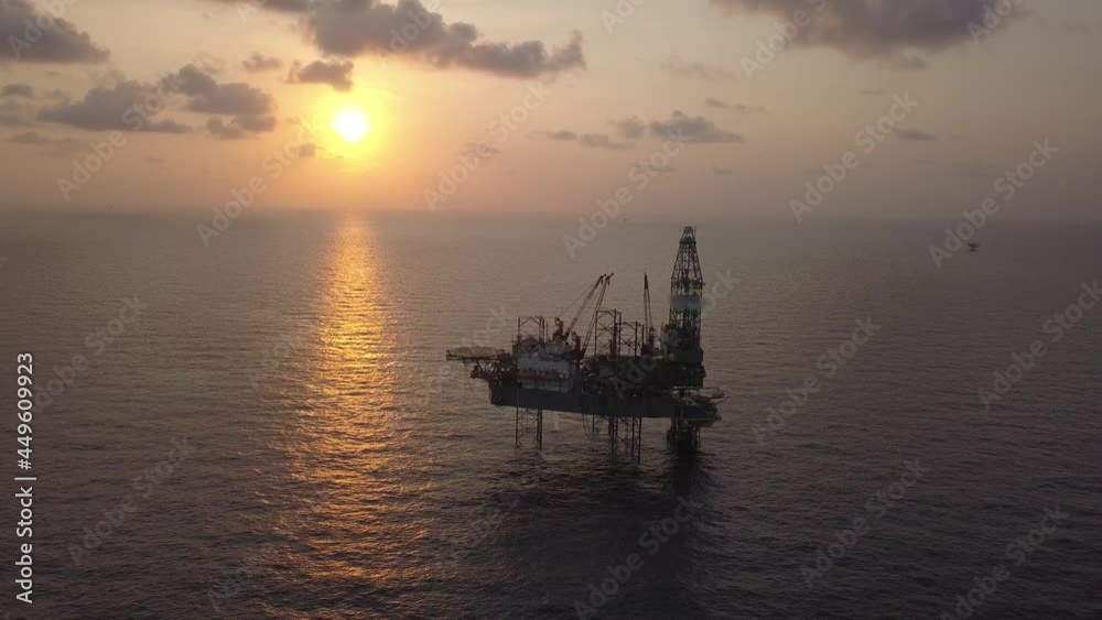 Aerial view of the jack up rig shot during sunset time. Fly around the jack up rig with a drone.
Aerial view of the jack up rig shot during sunset time. Fly around the jack up rig with a drone.