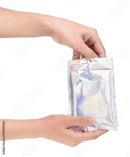 hand holding Aluminum foil bag Plastic Laser Mylar Foil Zip Lock Bag isolated on white background.