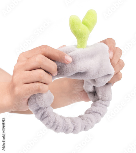 Hand holding Accessories Lovely of Plant Soft Women Headband isolated on white background.