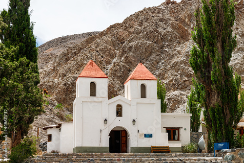 Facade of Iglesia San Cayetano with hills in the background in El Alfarcito, Salta, Argentina photo