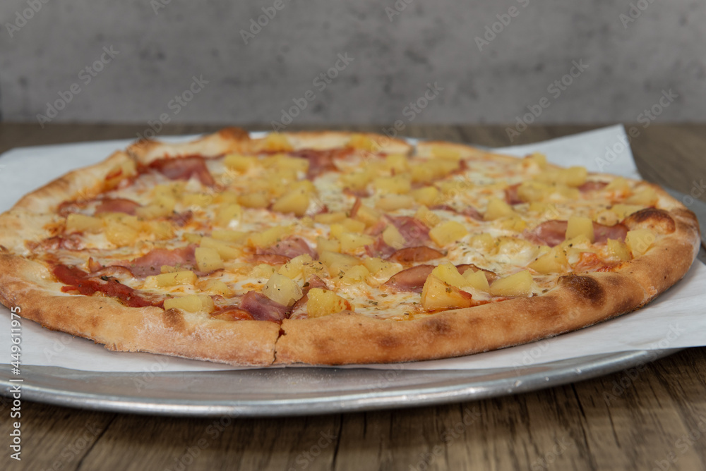 Hawaiian pineapple pizza loaded with vegetable toppings and a crispy ...